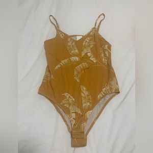 Gold H&M bodysuit.